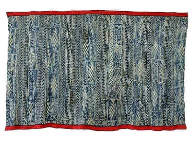 Ndop royal display cloth — the indigo-and-white pattern woven through this site. Photo from the LAFABA archive.